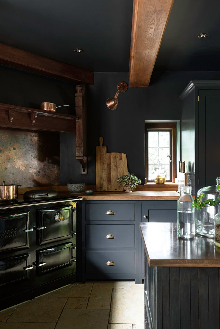 dark navy units in dark kitchen