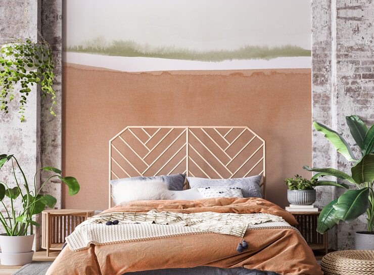 Clay plaster mural in boho bedroom